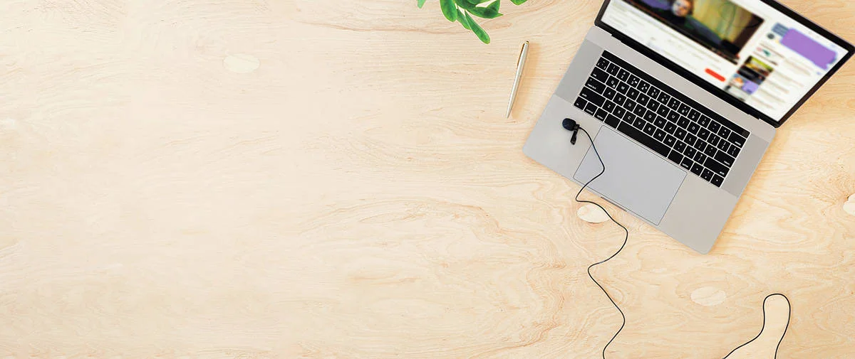 Online education or training concept top view. Laptop on the table with a live stream of teacher or coach.